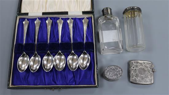 A cased set of six silver teaspoons, a silver vesta case, two toilet bottles and a pill box.